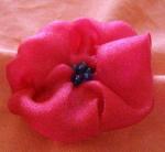 Fabric flower with beaded center Fabric flower with beaded center