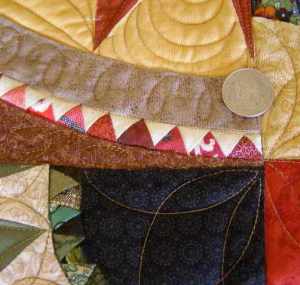 The red 1/2" triangles include fabrics from my Grandmother's Stash