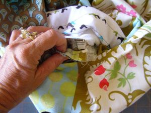 14.  Pull two base seams through base opening and align two sides seams.