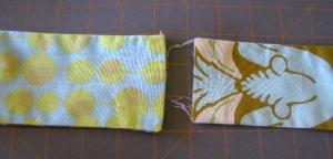 18.  Fold ends of wider handle to the inside and press.