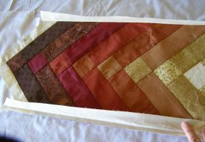 9. Edges trimmed, design pinned and ready to be sewn to second foundation fabric.