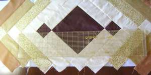 3.  After first strip, the squares are sewn to the next darker color rectangles.