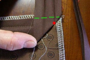 4.  Fold bias binding straight up to form a 45 degree angle.  Then fold down along green dotted line.