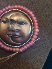 Photo 5:  Sewing second row of beads to fabric