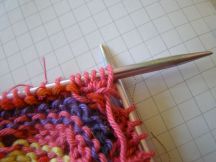 Turn work again (wrong side facing) and knit the five stitches.