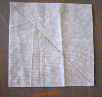 Diagonal line drawn on BACK SIDE of light blue square.