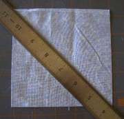 draw a diagonal line one THE BACK of each light blue square.