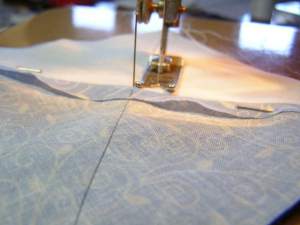 Leaving Poke Pin in until pressure foot is very close.