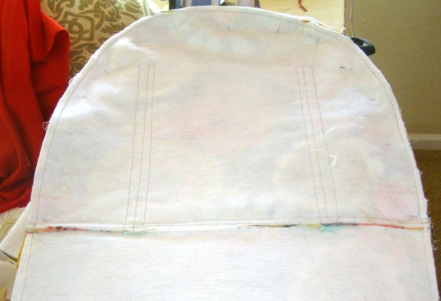 Top pinned to SIdes - sew along piping seam from centerpoint toward Base.