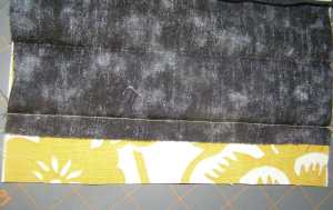 Seam of pocket sewn in 1/2' pressed line.