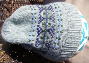 Slouch hat in greens and blues.